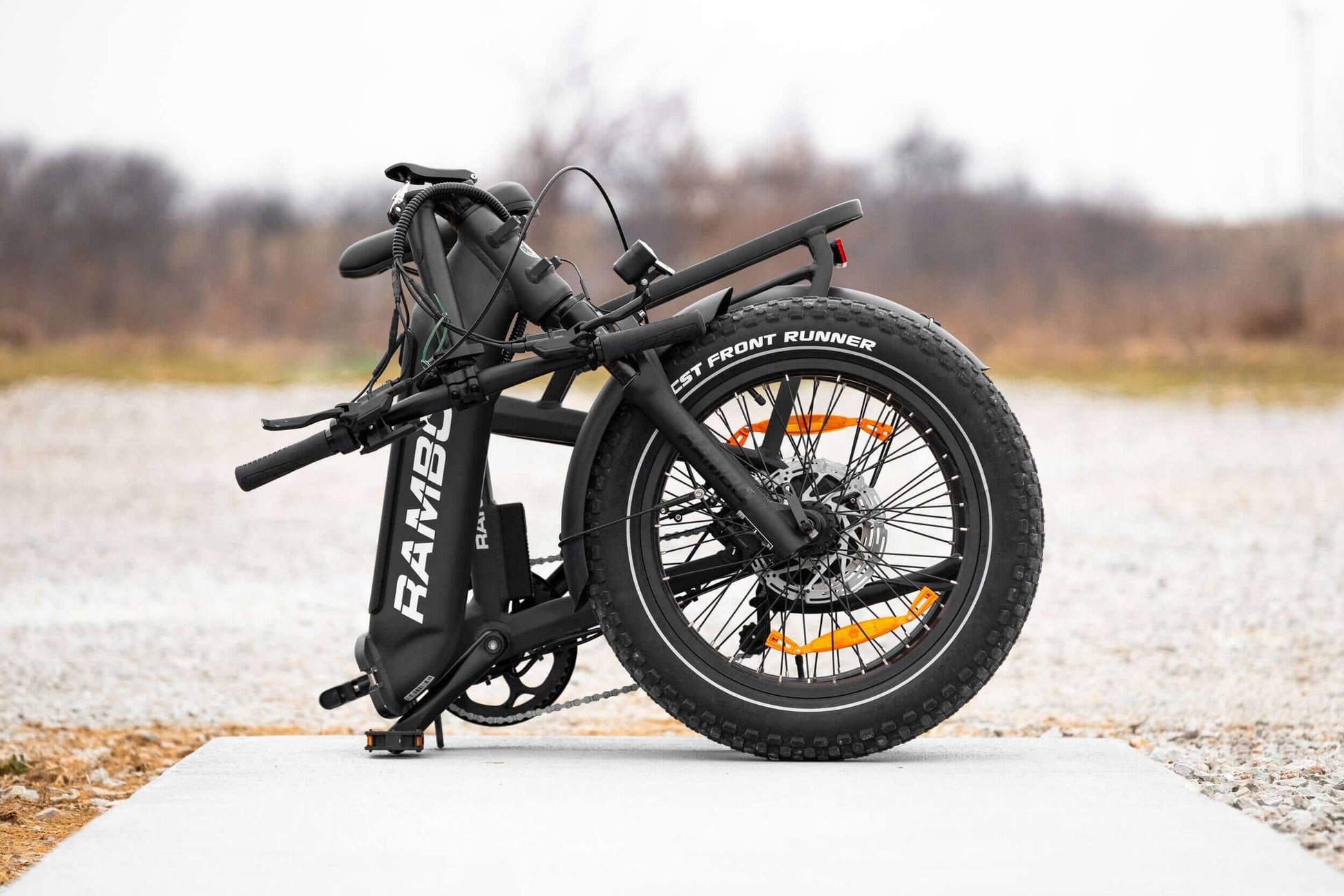 Folded Rambo Bikes RANGER Folding eBike showcasing its compact design and fat tires, ideal for portability and outdoor adventures.