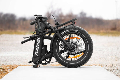 Folded Rambo Bikes RANGER Folding eBike showcasing its compact design and fat tires, ideal for portability and outdoor adventures.
