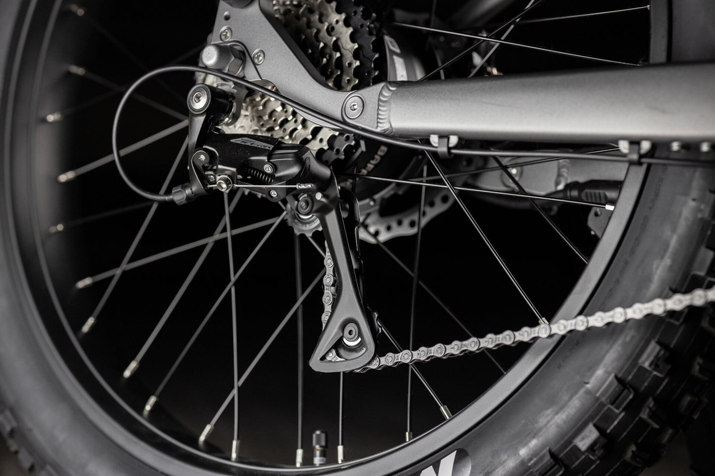 Close up of Rambo Bike Hellcat 2.0 AWD Electric Bikes chain system on a black background