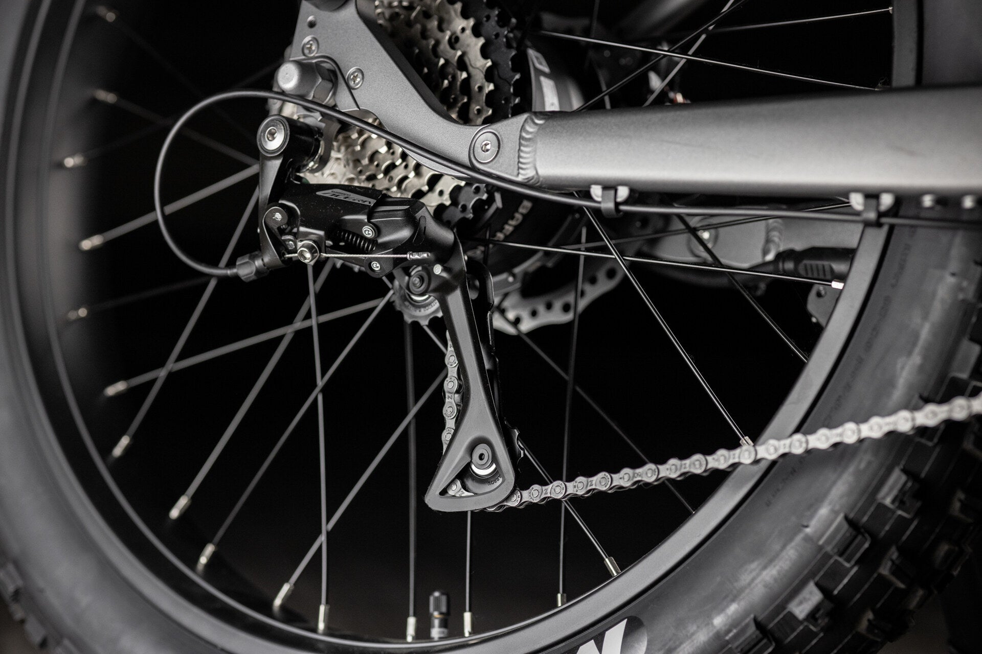 Close up of Rambo Bike Hellcat 2.0 AWD Electric Bikes chain system on a black background