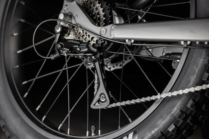 Close up of Rambo Bike Hellcat 2.0 AWD Electric Bikes chain system on a black background