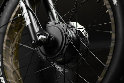 Close-up of Rambo Bikes Krusader 3.0 All-wheel drive Electric Bikes front wheel and front motor hub on black background
