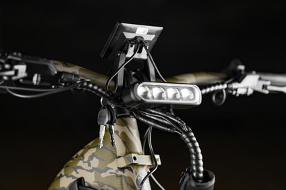 Close-up of Rambo Bikes Krusader 3.0 All-wheel drive Electric Bikes headlight on black background