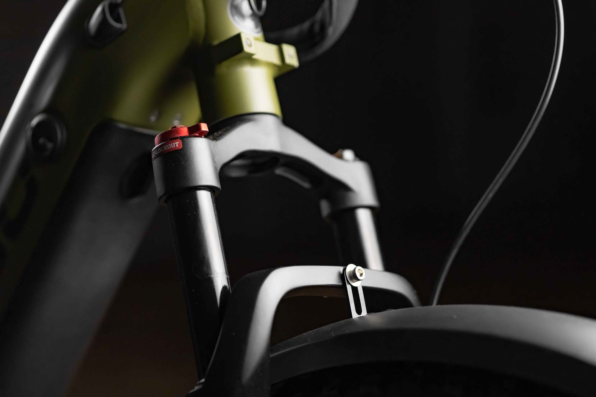 Close-up of a Rambo Bikes REBEL 2.0 Electric Bike suspension fork with a dark background