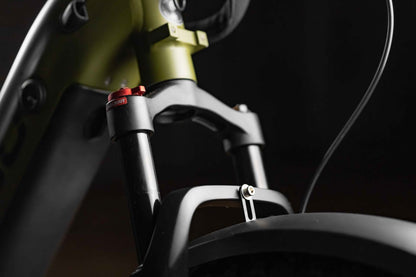 Close-up of a Rambo Bikes REBEL 2.0 Electric Bike suspension fork with a dark background