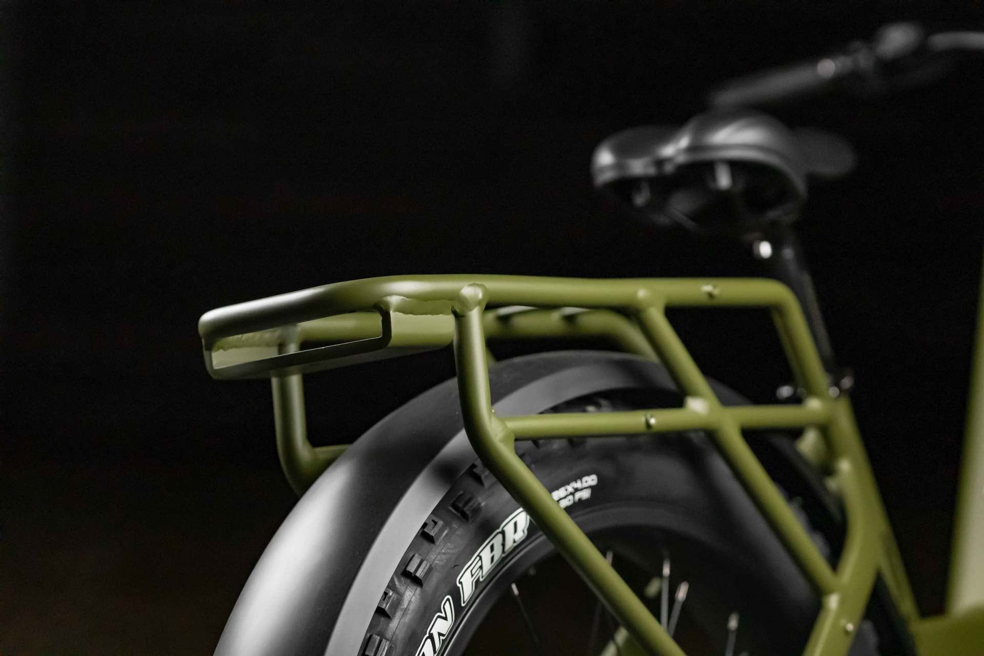 Close-up of Rambo Bikes REBEL 2.0 Electric Bikes rear wheel and rear rack on dark background
