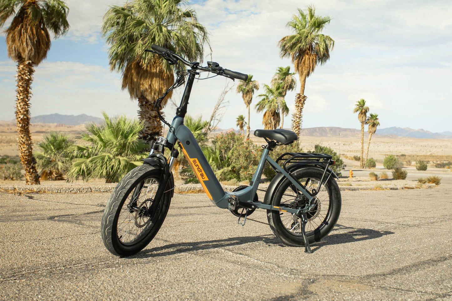 EUNORAU META Foldable electric bike with 20-inch wheels, front suspension, foldable frame, and 7-speed Shimano gearing.