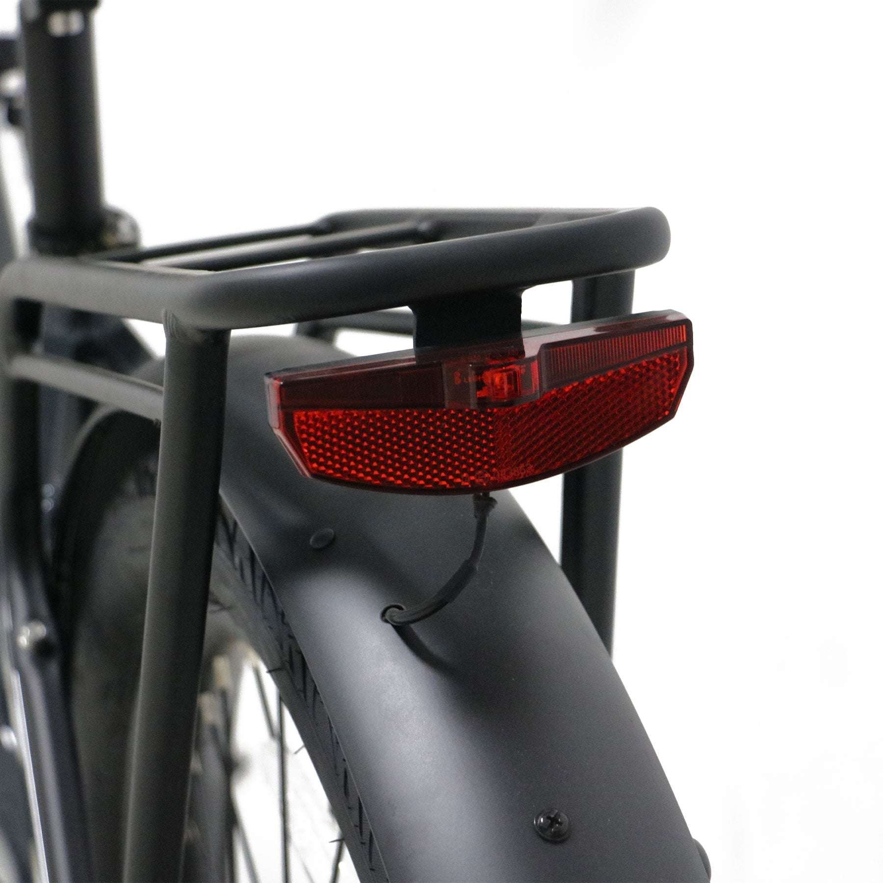 Eunorau Meta 275 Step-through electric bike close up of a red reflector attached to a rear rack on a white background