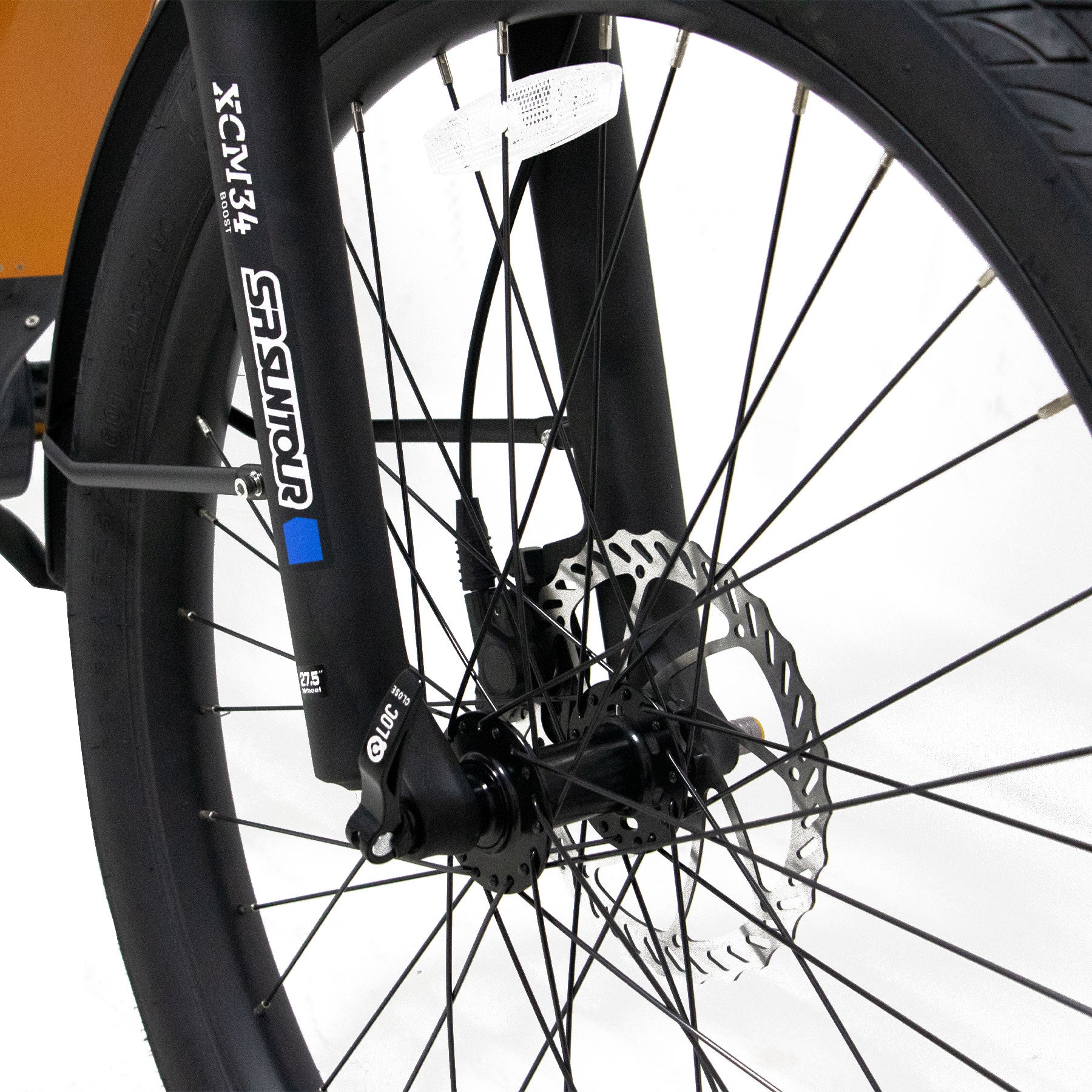 Eunorau Meta 275 1.0 Electric Bike Close-up of a frontwheel with suspension fork and hydraulic brakes on a white background