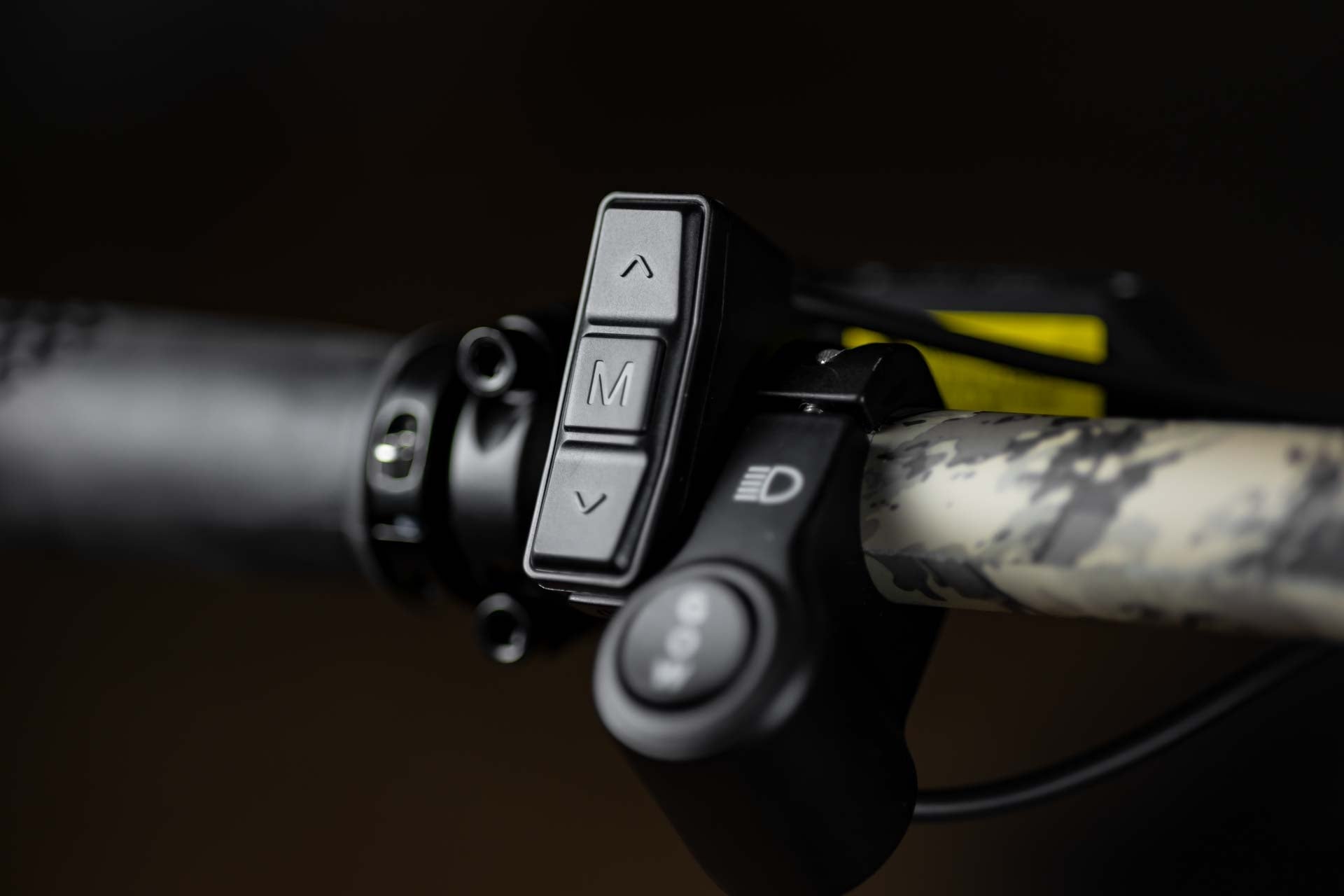 Close-up of Rambo Bike Megatron 4.0 AWD Electric bikes left handlebar with speed control, headlight button and brake lever 