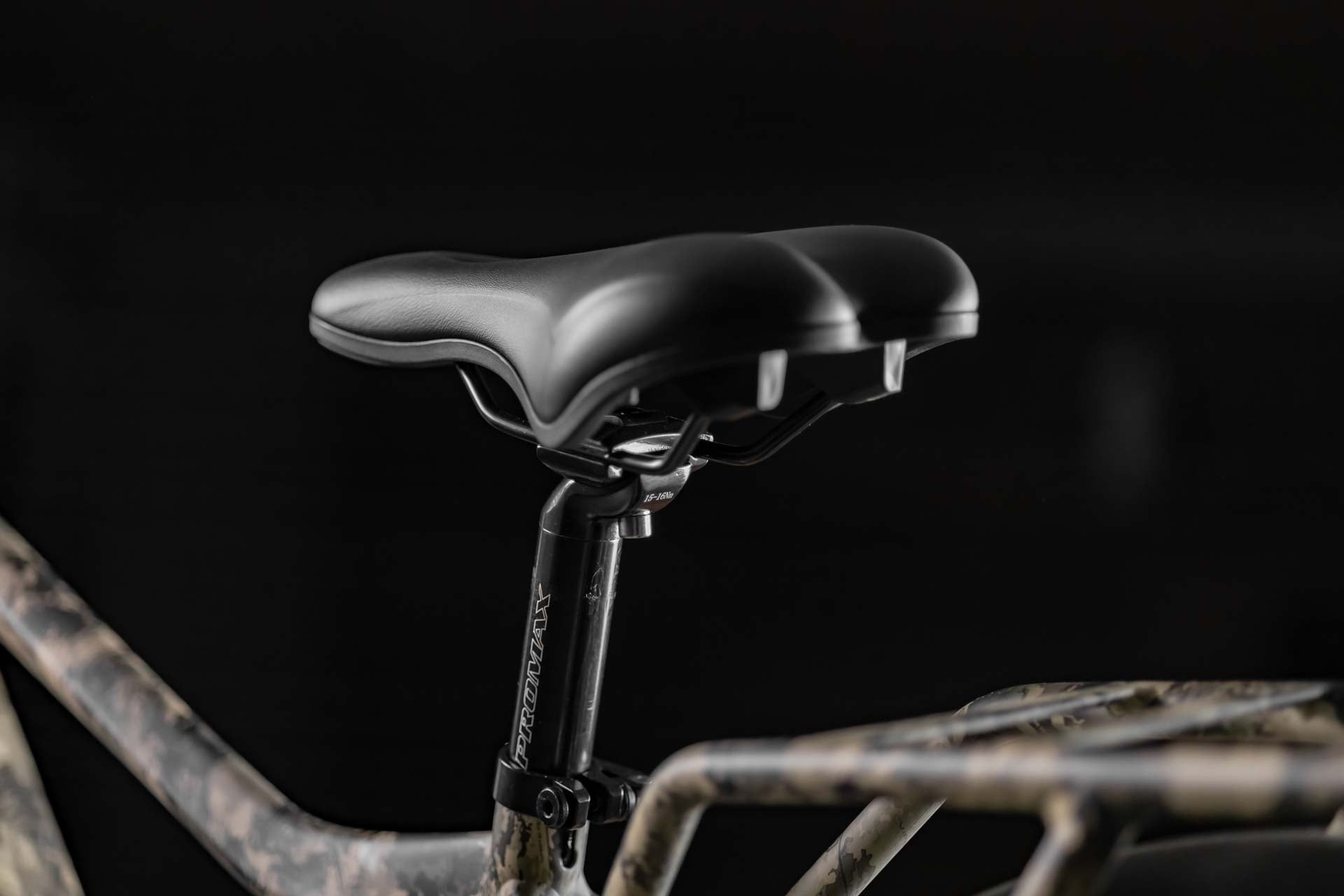 Close-up of Rambo Bike Megatron 4.0 AWD Electric bikes seat on black background