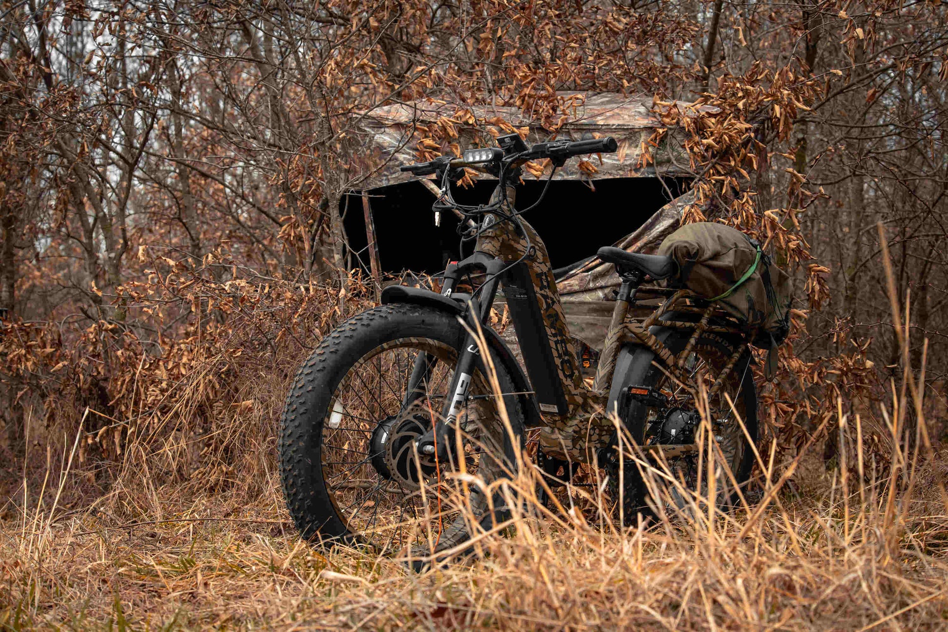 Rambo Bikes Krusader 3.0 All-wheel drive Electric Bike with full gear in the forest with trees in the background