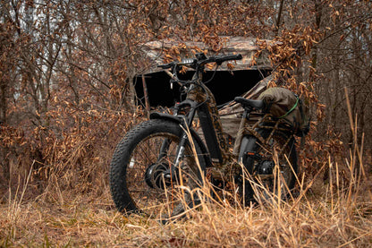 Rambo Bikes Krusader 3.0 All-wheel drive Electric Bike with full gear in the forest with trees in the background
