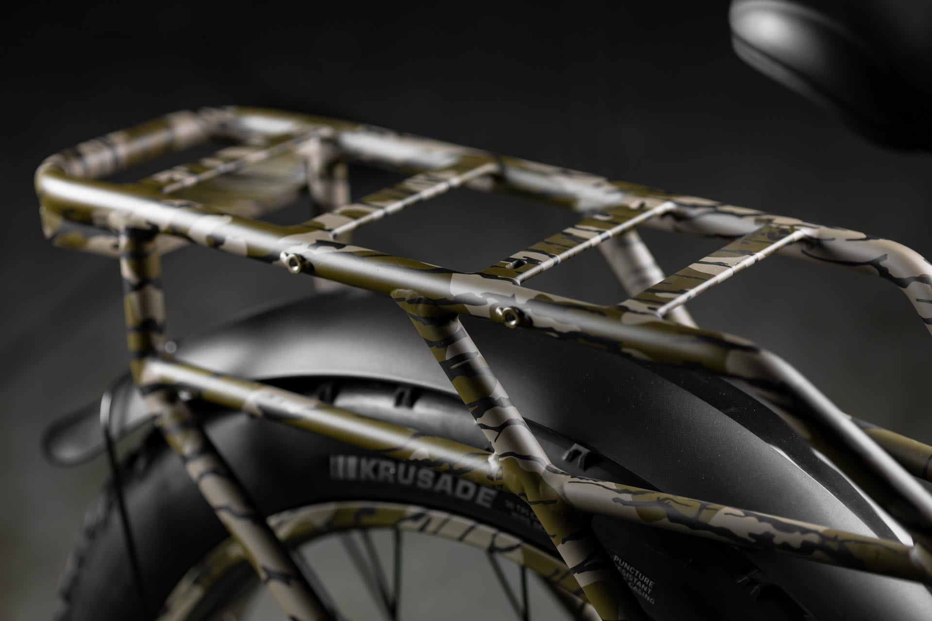 Close-up of Rambo Bikes Krusader 3.0 All-wheel drive Electric Bikes rear rack on black background