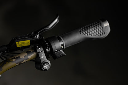 Close-up of Rambo Bikes Krusader 3.0 All-wheel drive Electric Bikes right handlebar with, all-wheel drive controls, brake lever and throttle on black background