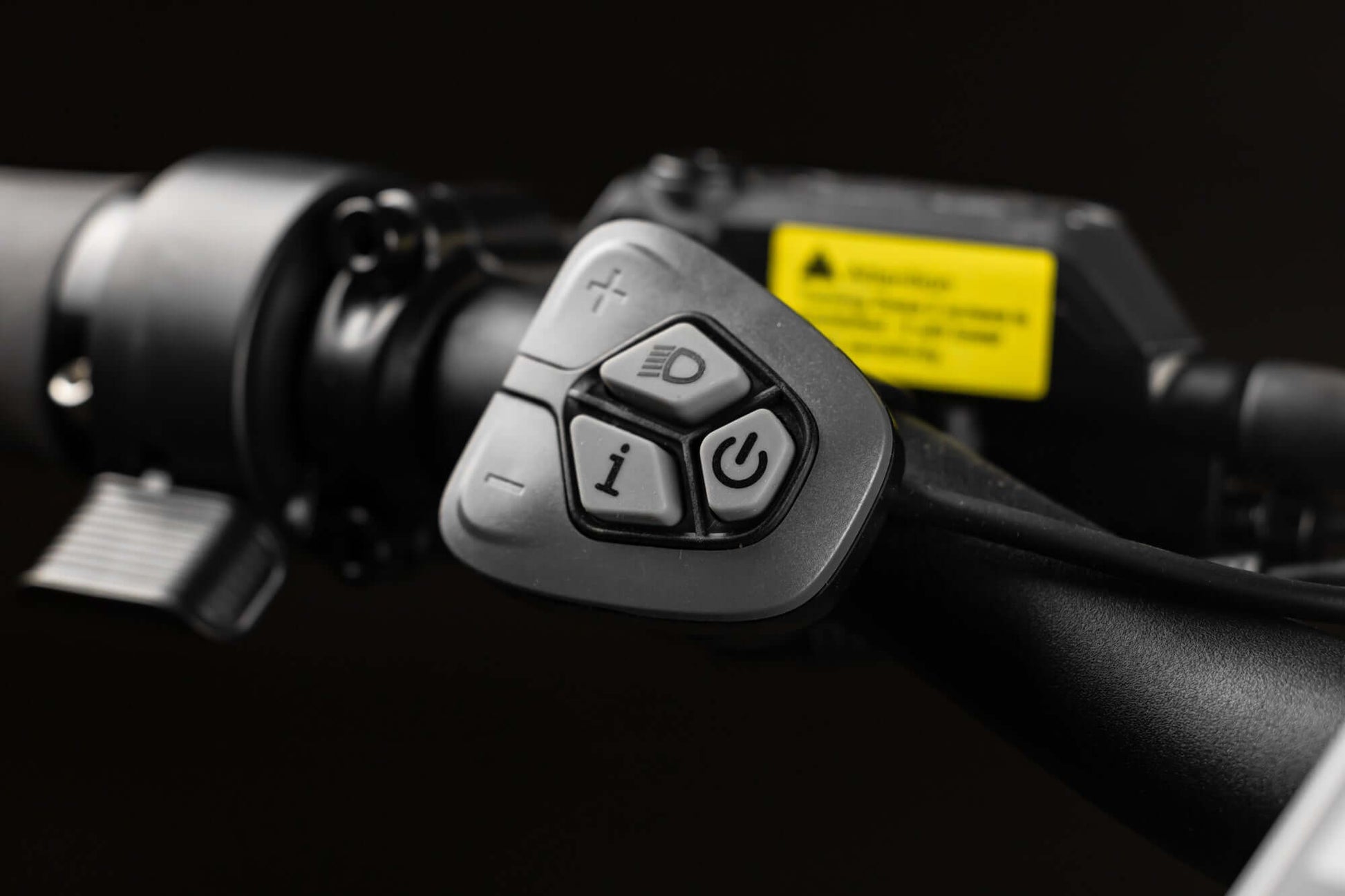 Close-up of Rambo Bikes SAVAGE 2.0 Electric Bikes control system on dark background