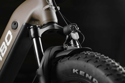 Close-up of a Rambo Bikes SAVAGE 2.0 Electric Bike front wheel and suspension fork on a dark background.