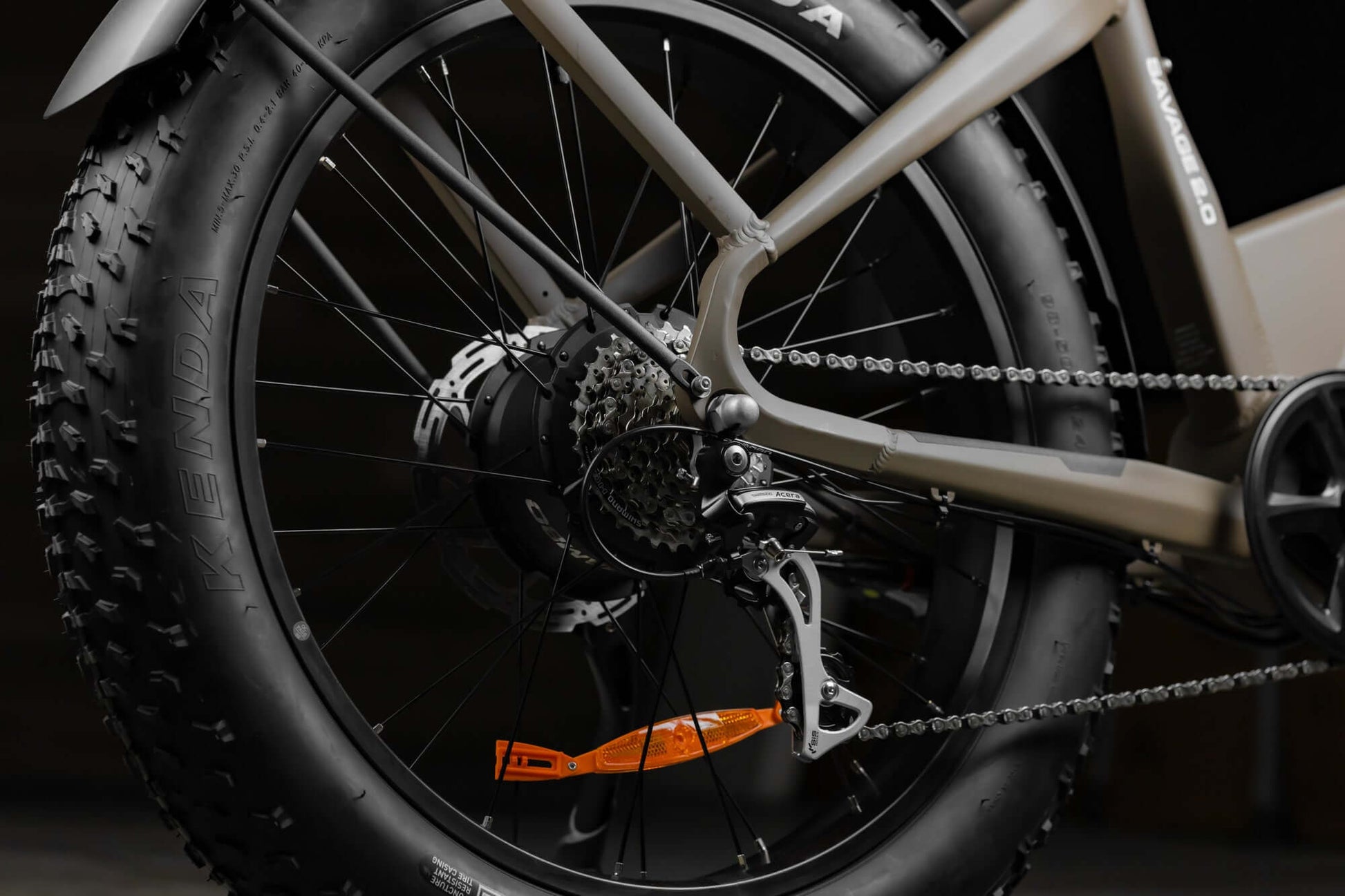 Close-up of Rambo Bikes SAVAGE 2.0 Electric Bikes gear system and rear wheel on dark background