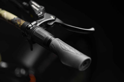 Close-up of Rambo Bikes Venom 2.0 Electric Bikes right handlebar with throttle and brake lever on dark background