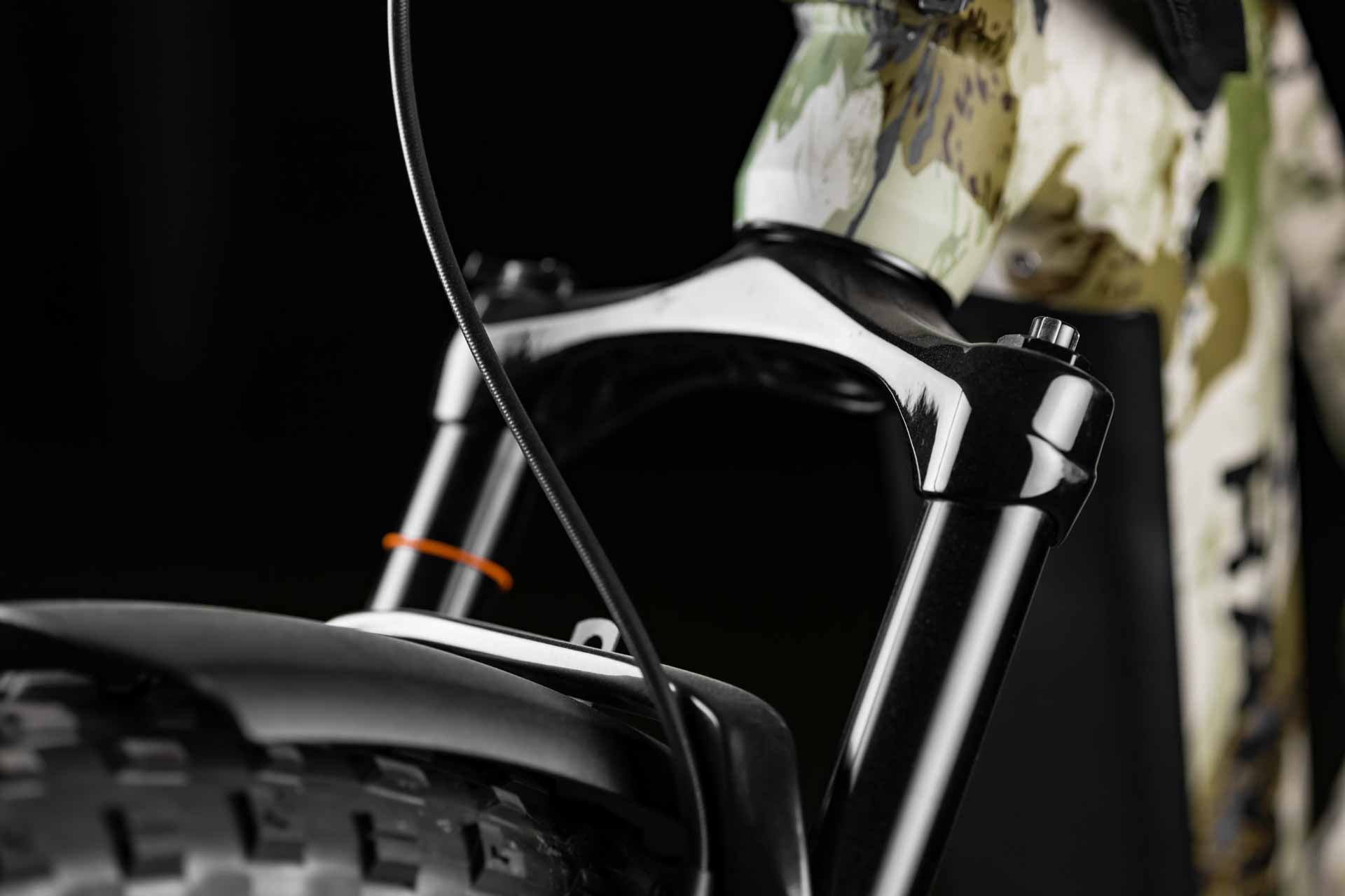 Close-up of Rambo Bikes Venom 2.0 Electric Bikes front suspension fork on a black background